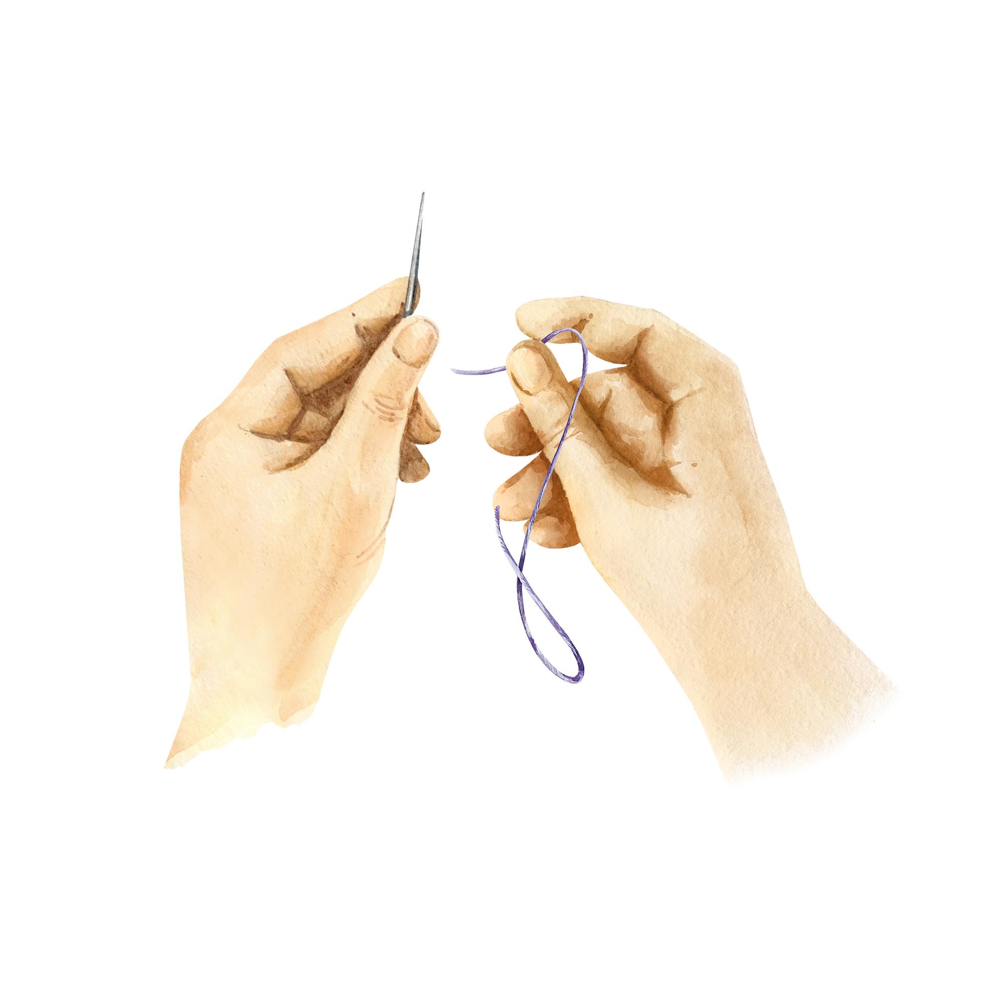 Hand pulling thread through linen with needle